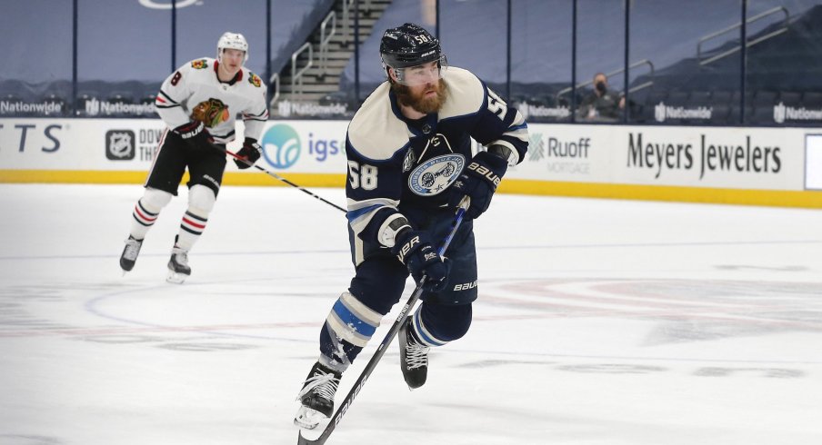 Feb 25, 2021; Columbus, Ohio, USA; Columbus Blue Jackets defenseman David Savard (58) carries the puck against the Chicago Blackhawks during the first period at Nationwide Arena.