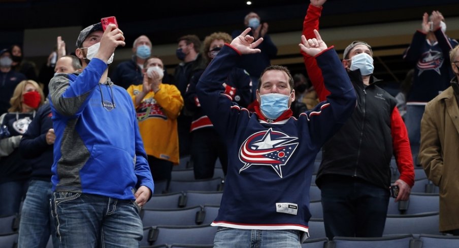 olumbus Blue Jackets fans celebrate a goal against the Detroit Red Wings during the second period at Nationwide Arena.