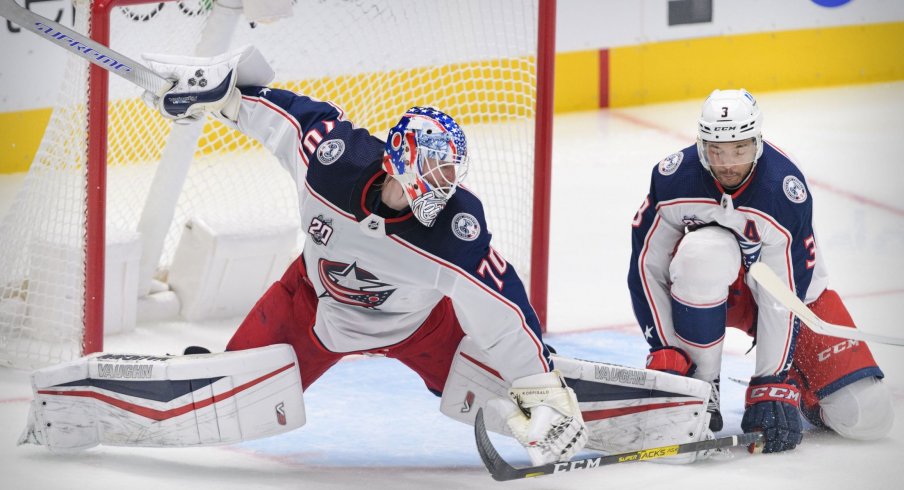Mar 6, 2021; Dallas, Texas, USA; Columbus Blue Jackets goaltender Joonas Korpisalo (70) and defenseman Seth Jones (3) defend against the Dallas Stars during the first period at the American Airlines Center.