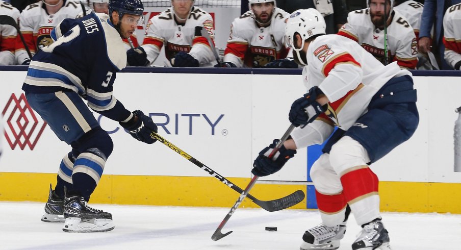 Mar 9, 2021; Columbus, Ohio, USA; Columbus Blue Jackets defenseman Seth Jones (3) chips the puck past Florida Panthers defenseman Radko Gudas (7) during the first period at Nationwide Arena.