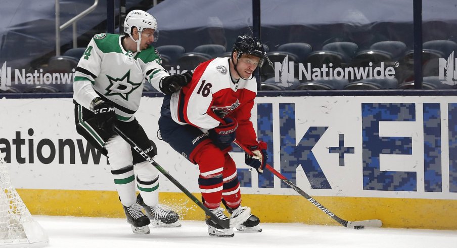 Feb 2, 2021; Columbus, Ohio, USA; Columbus Blue Jackets center Max Domi (16) looks to pass as Dallas Stars defenseman Miro Heiskanen (4) defends during the third period at Nationwide Arena.