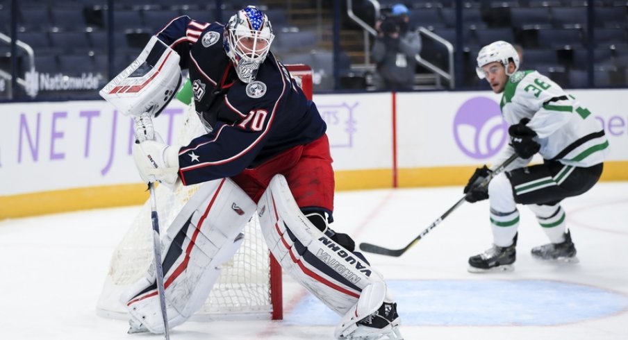 Columbus Blue Jackets goaltender Joonas Korpisalo (70) controls the puck against the Dallas Stars in the second period at Nationwide Arena.