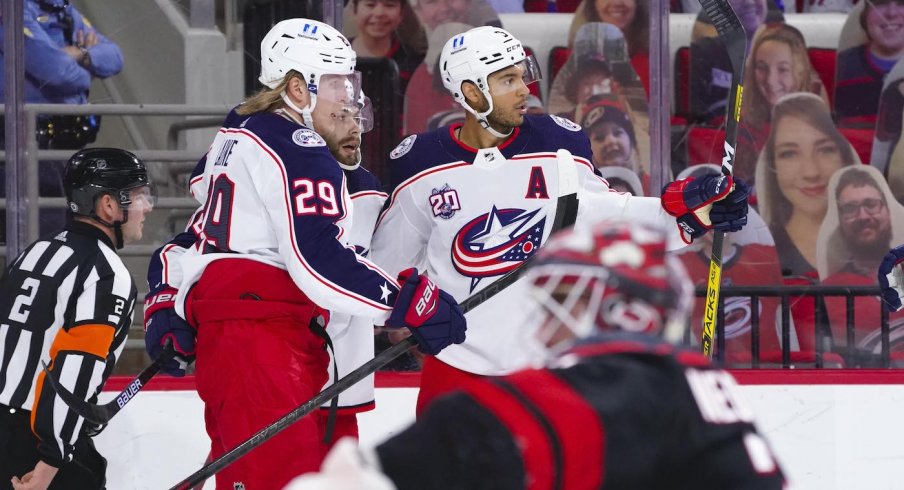 Columbus Blue Jackets defenseman Seth Jones (3) is congratulated by right wing Patrik Laine (29) after his first period goal against the Carolina Hurricanes at PNC Arena.