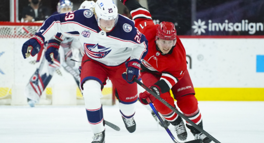 Columbus Blue Jackets right wing Patrik Laine (29) skates with the puck past Carolina Hurricanes right wing Jesper Fast (71) during the second period at PNC Arena.