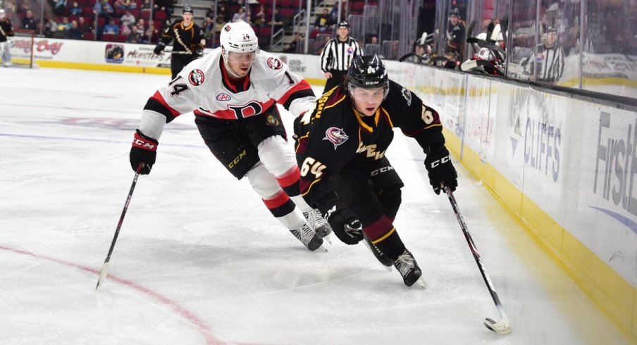 Trey Fix-Wolansky carries the puck.