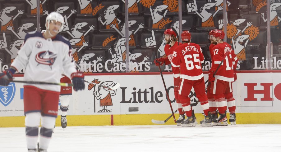 Detroit Red Wings center Michael Rasmussen (27) is congratulated by teammates after scoring in the third period against the Columbus Blue Jackets at Little Caesars Arena.