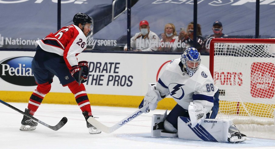 Apr 6, 2021; Columbus, Ohio, USA; Columbus Blue Jackets center Zac Dalpe (26) beats Tampa Bay Lightning goalie Andrei Vasilevskiy (88) on a backhander for a goal during the first period at Nationwide Arena.