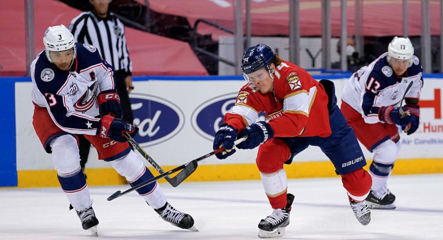 Columbus Blue Jackets defenseman Seth Jones (3) and Florida Panthers right wing Owen Tippett (74) battle for the puck during the second period at BB&T Center.