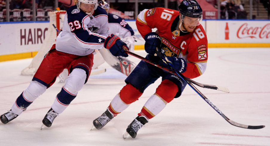 Florida Panthers center Aleksander Barkov (16) and Columbus Blue Jackets right wing Patrik Laine (29) chase a loose puck during the second period at BB&T Center.