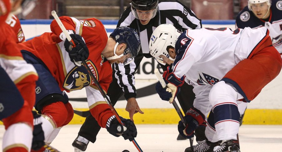 Apr 20, 2021; Sunrise, Florida, USA; Florida Panthers center Sam Bennett (9) and Columbus Blue Jackets center Jack Roslovic (96) face-off during the first period at BB&T Center.