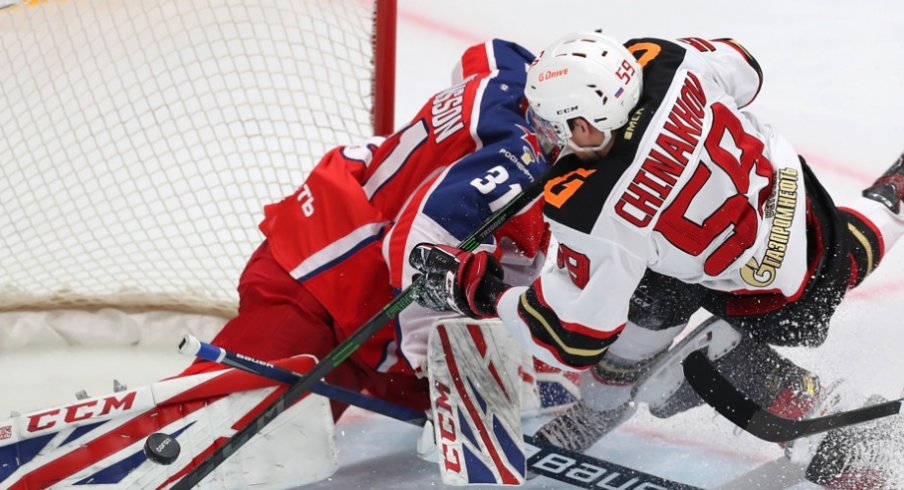 Yegor Chinakhov runs into goaltender Lars Johansson