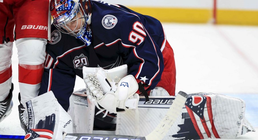 Apr 27, 2021; Columbus, Ohio, USA; Columbus Blue Jackets goaltender Elvis Merzlikins (90) makes a save in net against the Detroit Red Wings in the second period at Nationwide Arena.