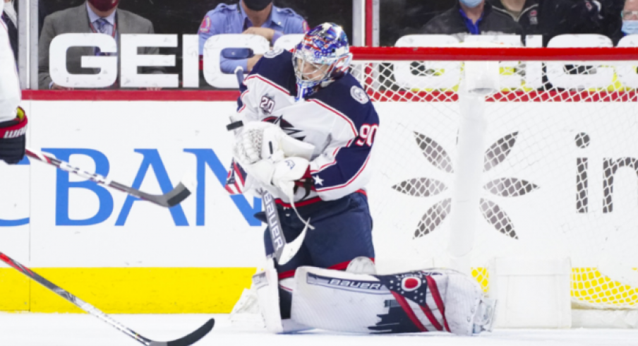 Elvis Merzlikins makes a save during second period action in the Columbus Blue Jackets overtime loss to Carolina.