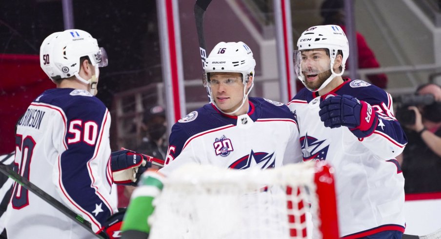 May 1, 2021; Raleigh, North Carolina, USA; Columbus Blue Jackets center Max Domi (16) is congratulated by center Boone Jenner (38) and left wing Eric Robinson (50) after scoring a first period goal against the Carolina Hurricanes at PNC Arena.