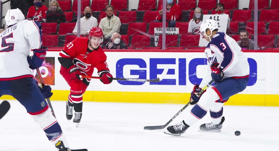 May 1, 2021; Raleigh, North Carolina, USA; Carolina Hurricanes right wing Andrei Svechnikov (37) takes a shot against Columbus Blue Jackets defenseman Seth Jones (3) at PNC Arena.