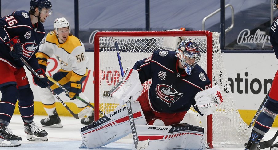 Elvis Merzlikins makes a save against the Nashville Predators