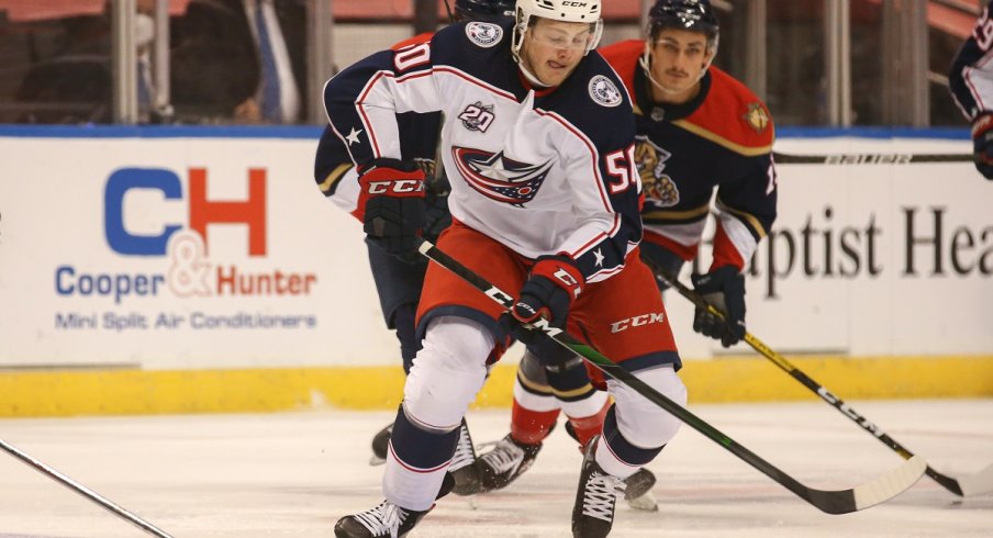 Eric Robinson skates with the puck against the Florida Panthers 