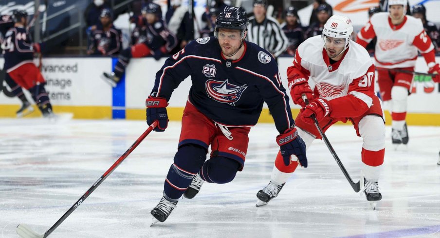 Apr 27, 2021; Columbus, Ohio, USA; Columbus Blue Jackets center Max Domi (16) controls the puck against Detroit Red Wings center Joe Veleno (90) in the third period at Nationwide Arena. 