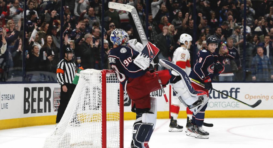 Columbus Blue Jackets goaltender Elvis Merzlikins celebrates his first NHL win over the Florida Panthers at Nationwide Arena.