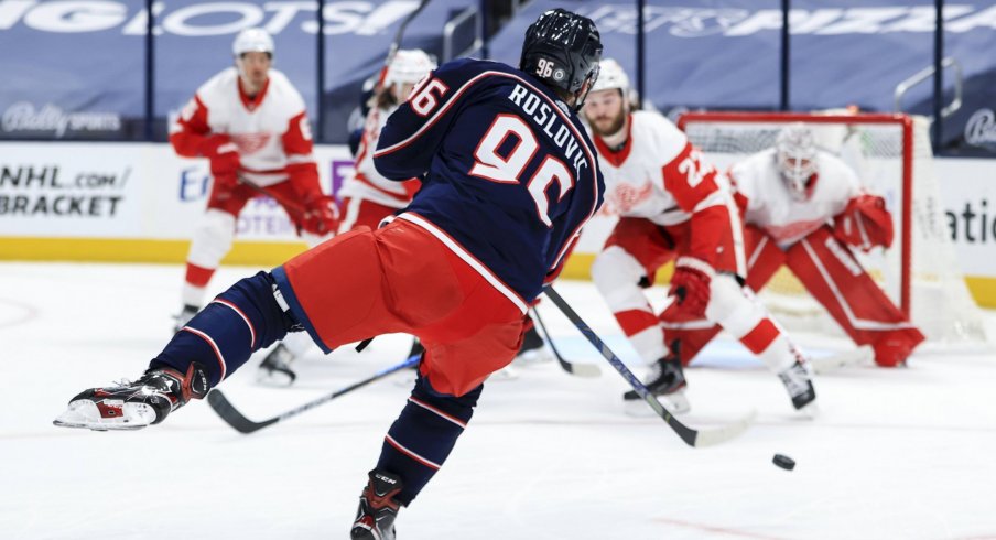 May 8, 2021; Columbus, Ohio, USA; Columbus Blue Jackets center Jack Roslovic (96) shoots and scores a goal against the Detroit Red Wings in the third period at Nationwide Arena.