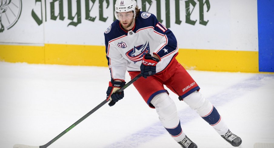 Mar 6, 2021; Dallas, Texas, USA; Columbus Blue Jackets center Kevin Stenlund (11) in action during the game between the Dallas Stars and the Columbus Blue Jackets at the American Airlines Center.