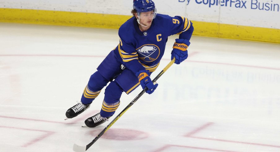 Feb 15, 2021; Buffalo, New York, USA; Buffalo Sabres center Jack Eichel (9) looks to make a pass during the first period against the New York Islanders at KeyBank Center.