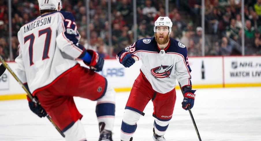 Oct 14, 2017; Saint Paul, MN, USA; Columbus Blue Jackets defenseman David Savard (58) celebrates forward Josh Anderson (77) goal in the third period against the Minnesota Wild at Xcel Energy Center.