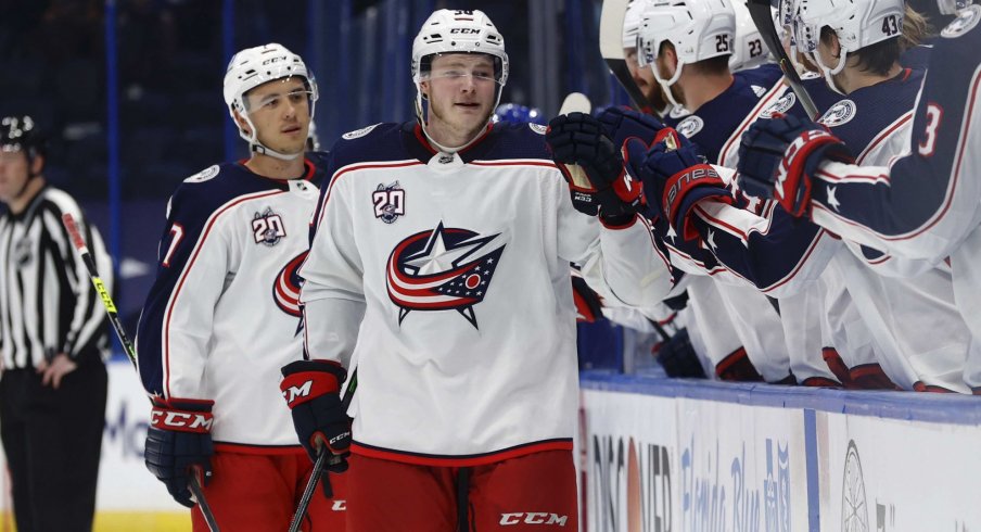 Apr 25, 2021; Tampa, Florida, USA; Columbus Blue Jackets left wing Eric Robinson (50) is congratulated as he scores a goal against the Tampa Bay Lightning uring the third period at Amalie Arena.