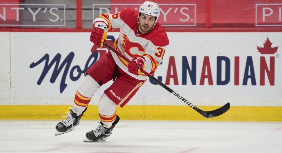 Mar 24, 2021; Ottawa, Ontario, CAN; Calgary Flames center Zac Rinaldo (36) moves the puck during the second period against the Ottawa Senators at the Canadian Tire Centre.