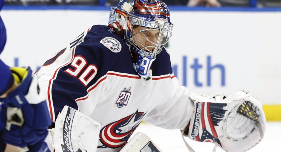 Apr 25, 2021; Tampa, Florida, USA; Columbus Blue Jackets goaltender Elvis Merzlikins (90) reacts against the Tampa Bay Lightning during the third period at Amalie Arena.