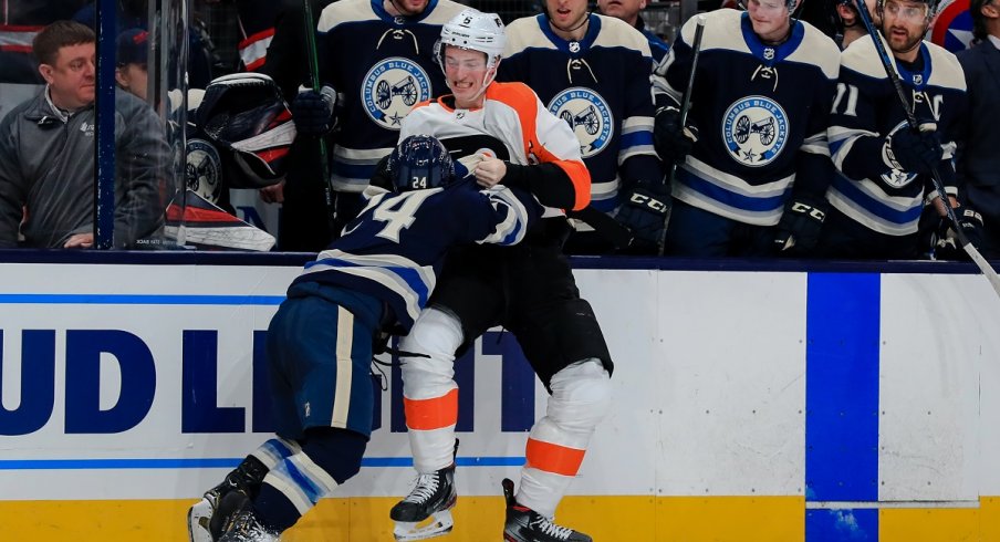 Nathan Gerbe fights Travis Sanheim at Nationwide Arena.