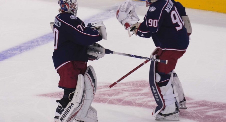 Aug 6, 2020; Toronto, Ontario, CAN; Columbus Blue Jackets goaltender Joonas Korpisalo (70) heads for the bench as he is replaced by goaltender Elvis Merzlikins (90) during the second period against the Toronto Maple Leafs in the Eastern Conference qualifications at Scotiabank Arena.