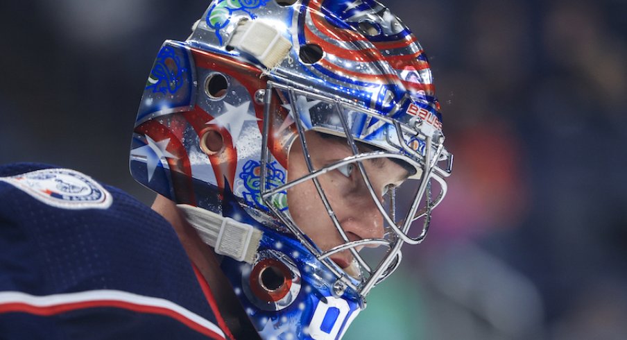 Columbus Blue Jackets goaltender Elvis Merzlikins (90) skates on the ice during a stop in play against the Chicago Blackhawks in the second period at Nationwide Arena