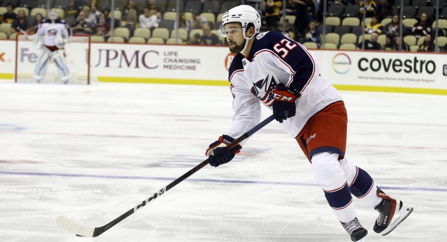 Sep 27, 2021; Pittsburgh, Pennsylvania, USA; Columbus Blue Jackets center Emil Bemstrom (52) skates with the puck against the Pittsburgh Penguins during the second period at PPG Paints Arena.