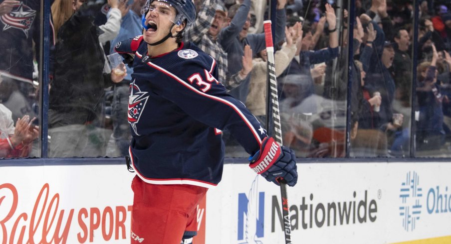 Oct 21, 2021; Columbus, Ohio, USA; Columbus Blue Jackets center Cole Sillinger (34) celebrates after scoring a goal against the New York Islanders in the second period at Nationwide Arena.