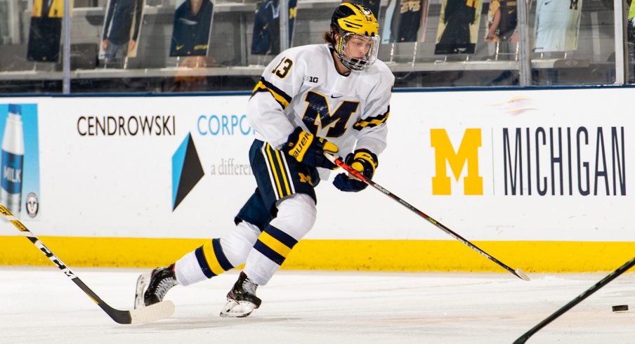 Kent Johnson skates with the puck.