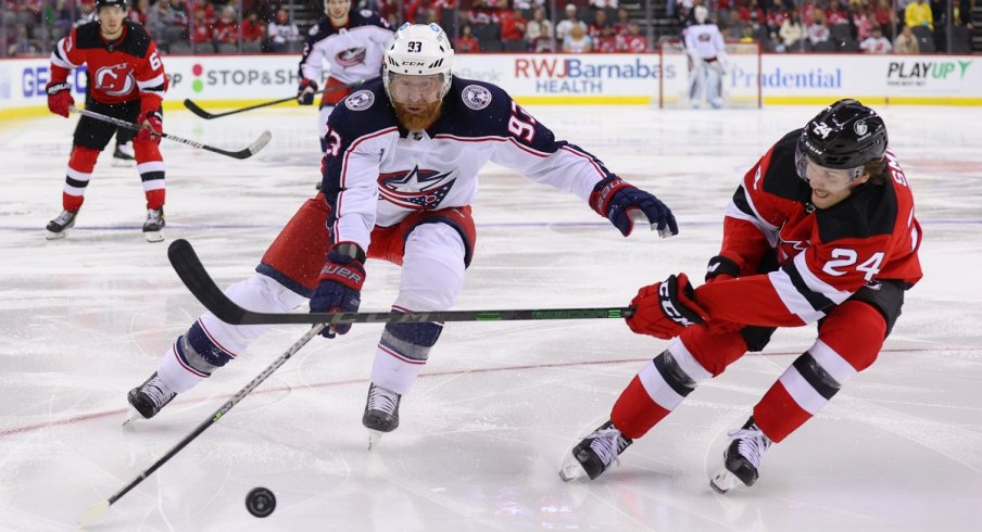 Jakub Voracek fights for a loose puck against the New Jersey Devils