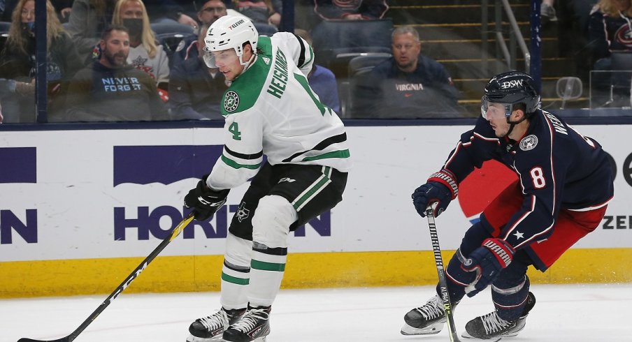 Zach Werenski defends against the Dallas Stars