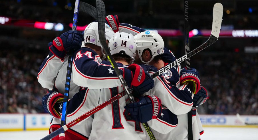 Members of the Columbus Blue Jackets celebrate a goal in the third period against the Colorado Avalanche at Ball Arena.