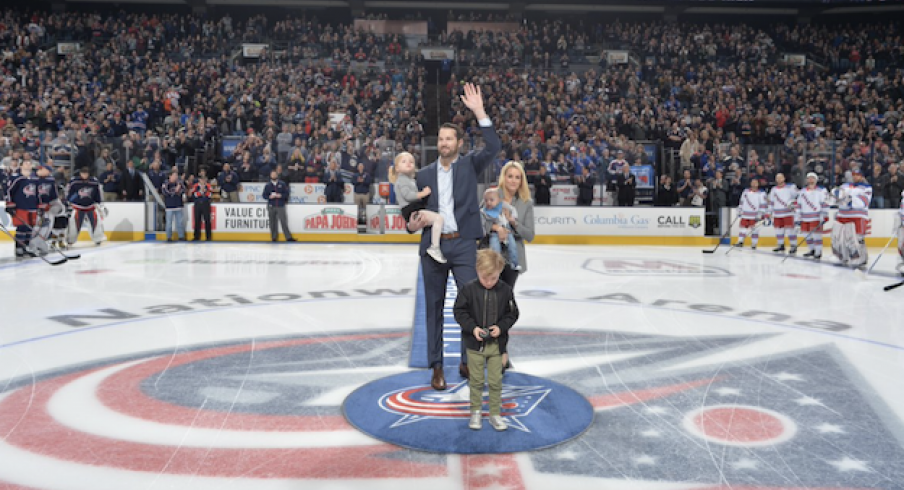 Former Blue Jackets captain Rick Nash salutes the crowd at Nationwide Arena along with wife, Jessica and two children.
