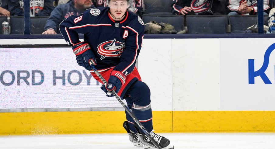 Columbus Blue Jackets defenseman Zach Werenski (8) moves the puck in the second period against the New York Rangers at Nationwide Arena.