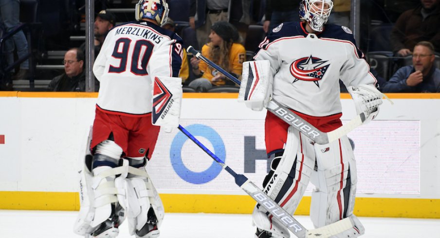 Elvis Merzlikins is pulled for Joonas Korpisalo in the first period of the Columbus Blue Jackets' game against the Nashville Predators at Bridgestone Arena.