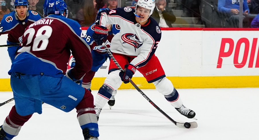 Cole Sillinger with the puck against the Colorado Avalanche 