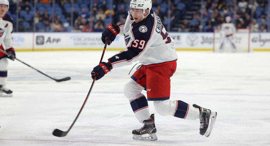 Yegor Chinakhov skates with the puck