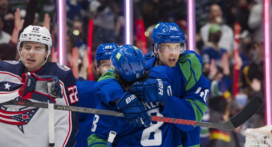 The Vancouver Canucks celebrate a goal against the Columbus Blue Jackets