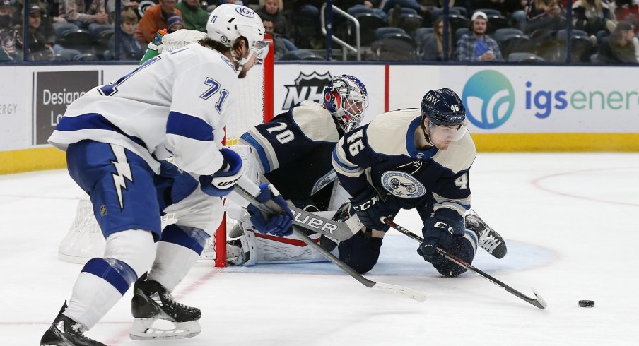 Dean Kukan blocks a shot in his return to the Columbus Blue Jackets' lineup Tuesday in a 7-2 loss to Tampa Bay.