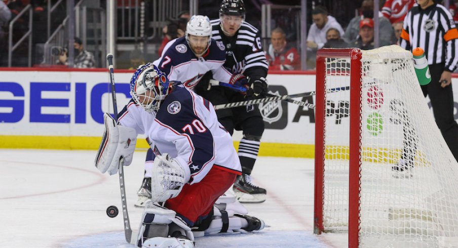 Joonas Korpisalo makes a save for the Columbus Blue Jackets against the New Jersey Devils in the second period at Prudential Center.