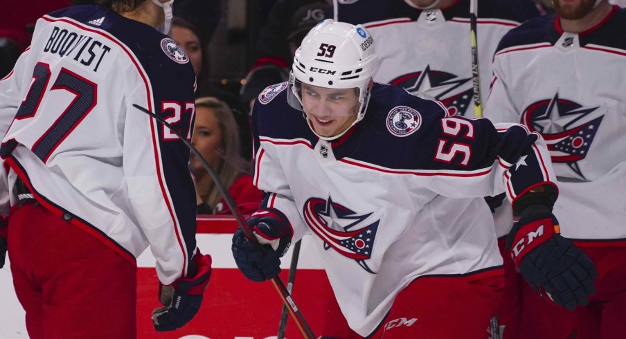 Caption: Jan 13, 2022; Raleigh, North Carolina, USA; Columbus Blue Jackets right wing Yegor Chinakhov (59) scores a goal against the Carolina Hurricanes during the second period at PNC Arena.