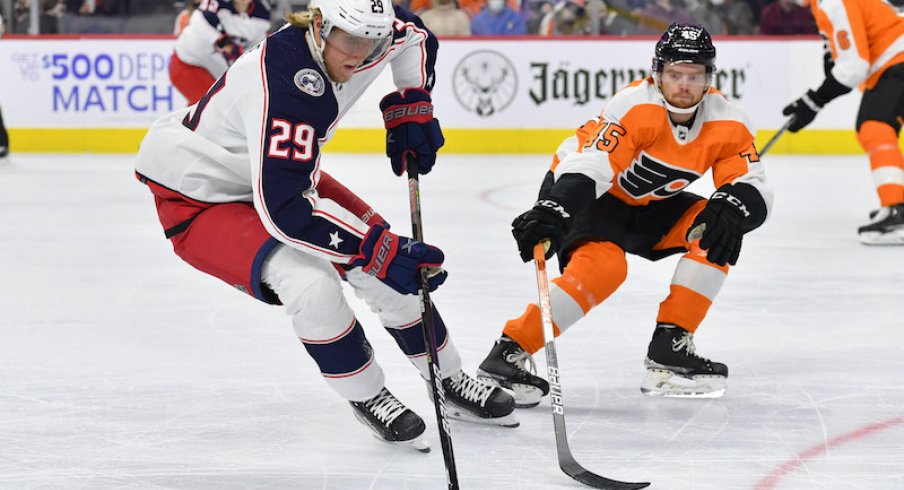 Columbus Blue Jackets's Patrik Laine is defended by Philadelphia Flyers' Cam York in the first period.