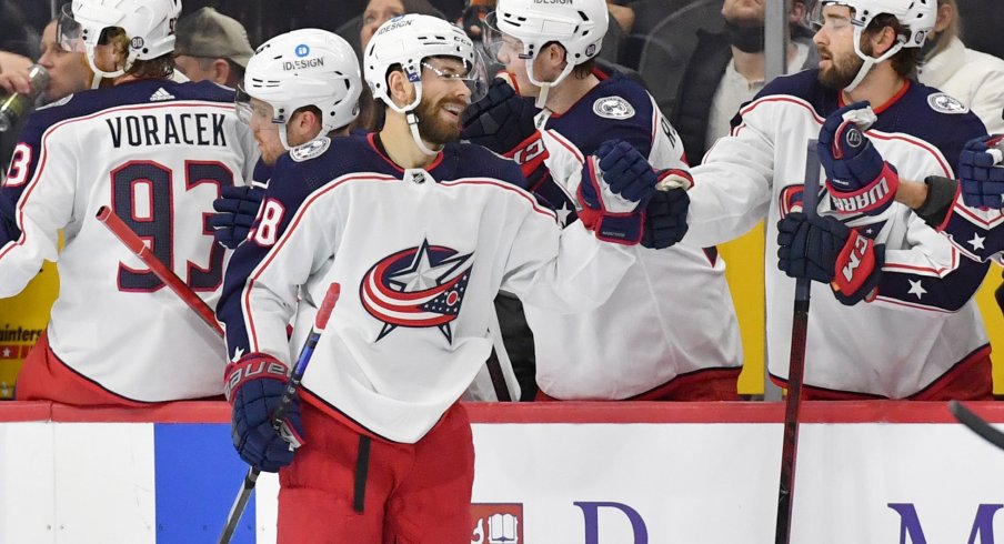 Jan 20, 2022; Philadelphia, Pennsylvania, USA; Columbus Blue Jackets right wing Oliver Bjorkstrand (28) celebrates his goal with teammates against the Philadelphia Flyers during the second period at Wells Fargo Center.